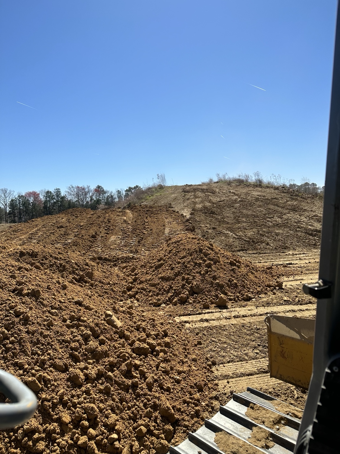 Land shaping and earthwork performed with heavy equipment